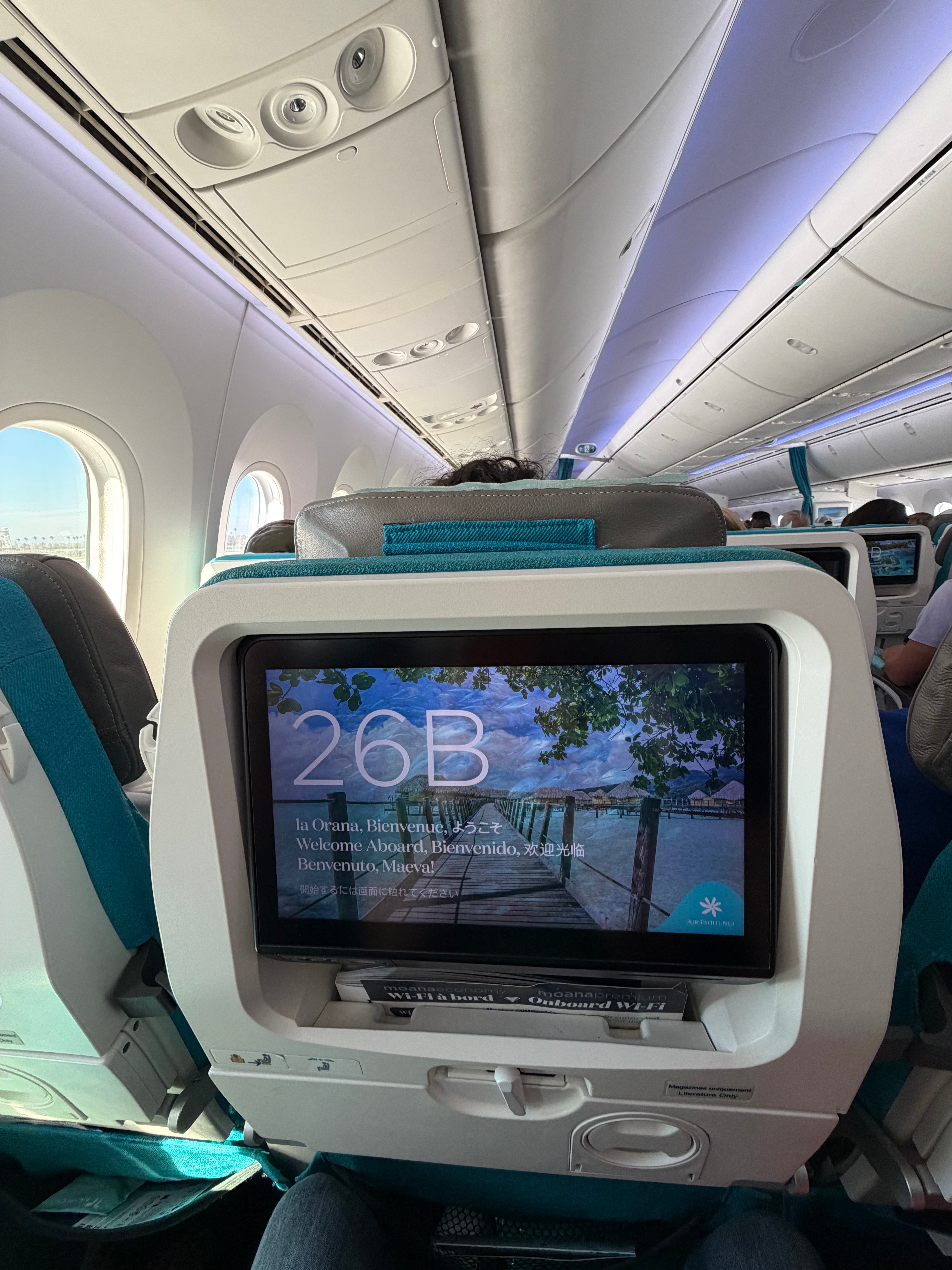 Air Tahiti Nui entertainment screen at Moana Economy seat 26B.