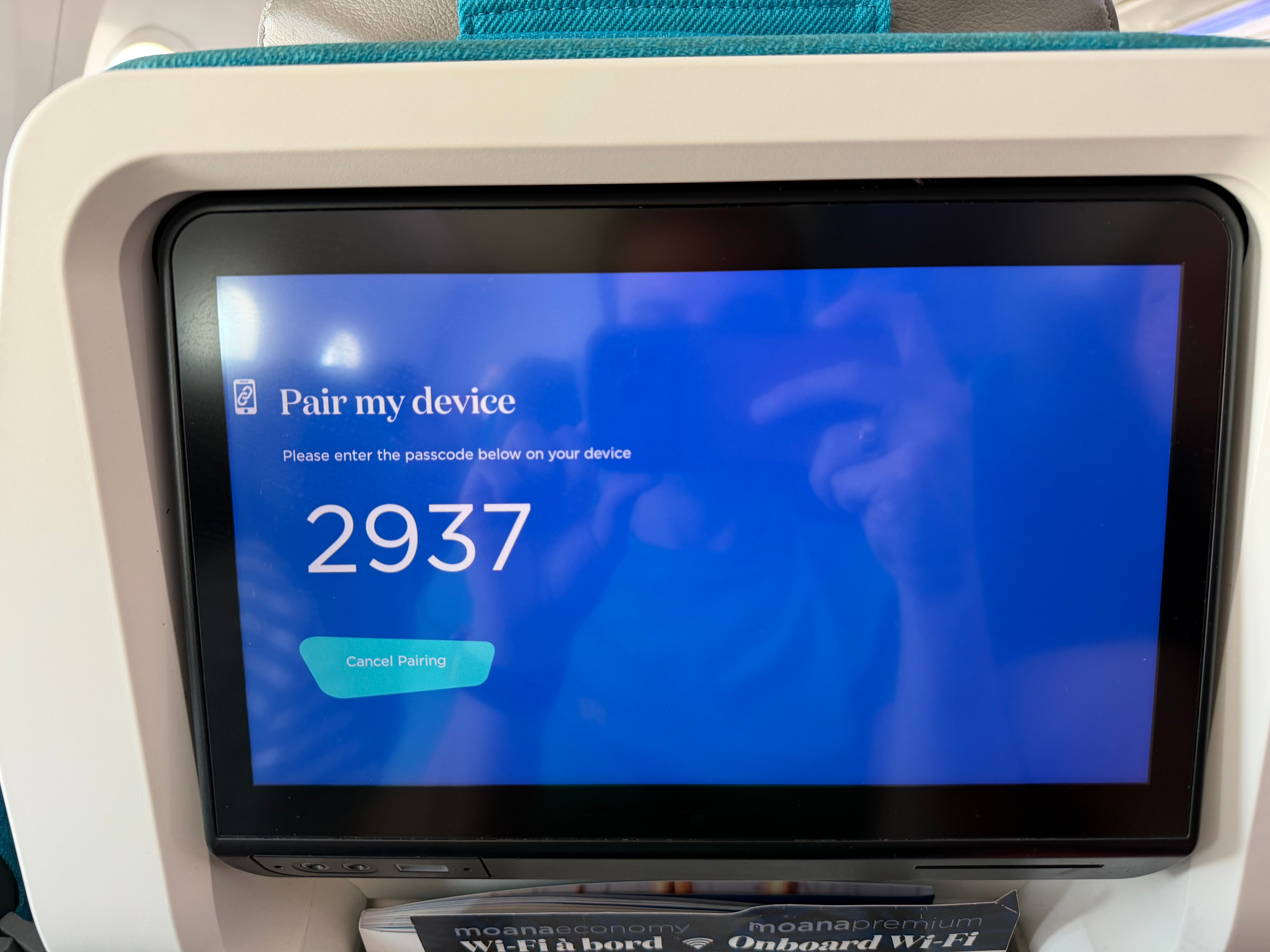 Temporary pairing code on the Air Tahiti Nui seatback entertainment screen.