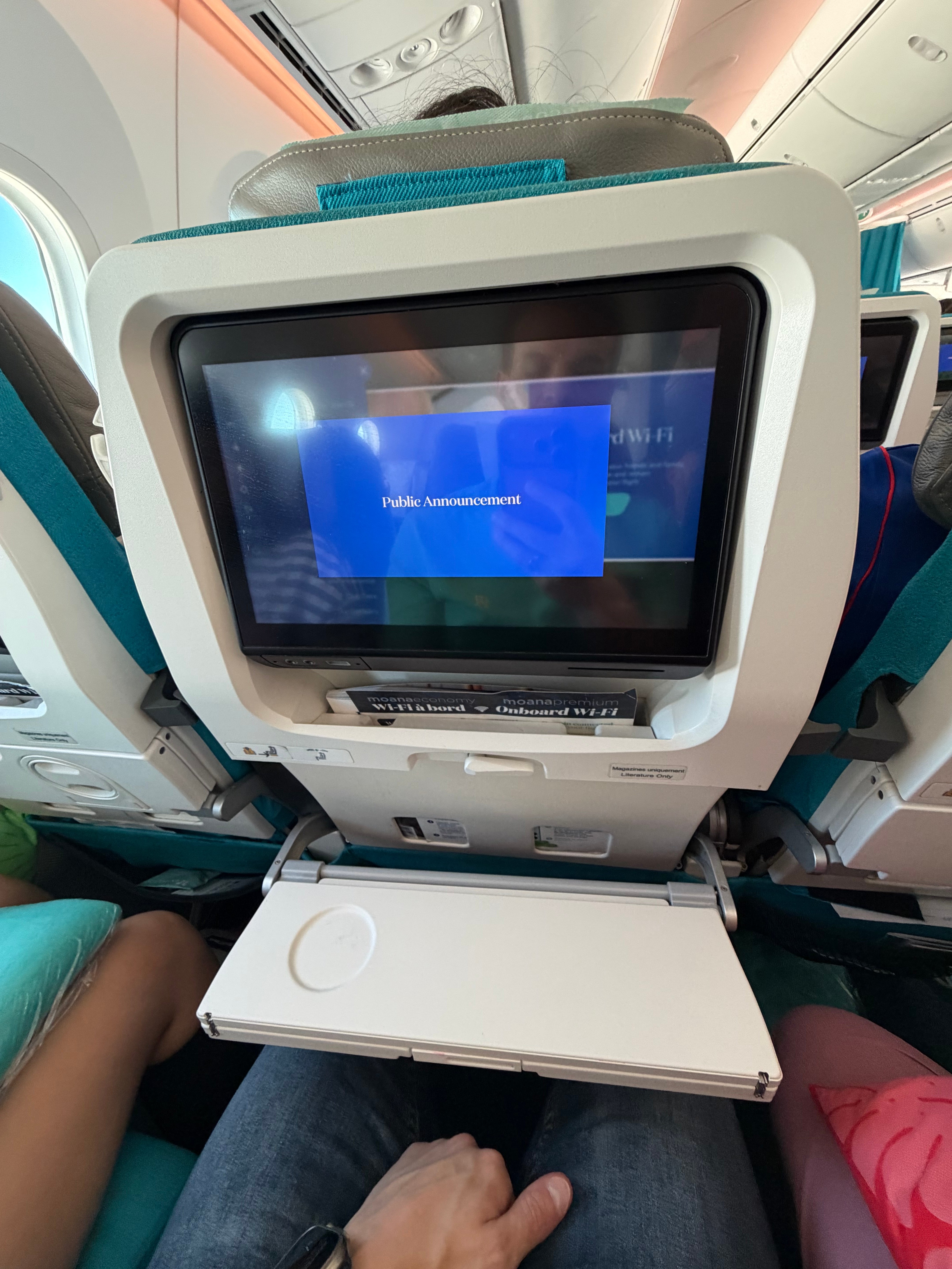 Air Tahiti Nui Economy tray table opened halfway.