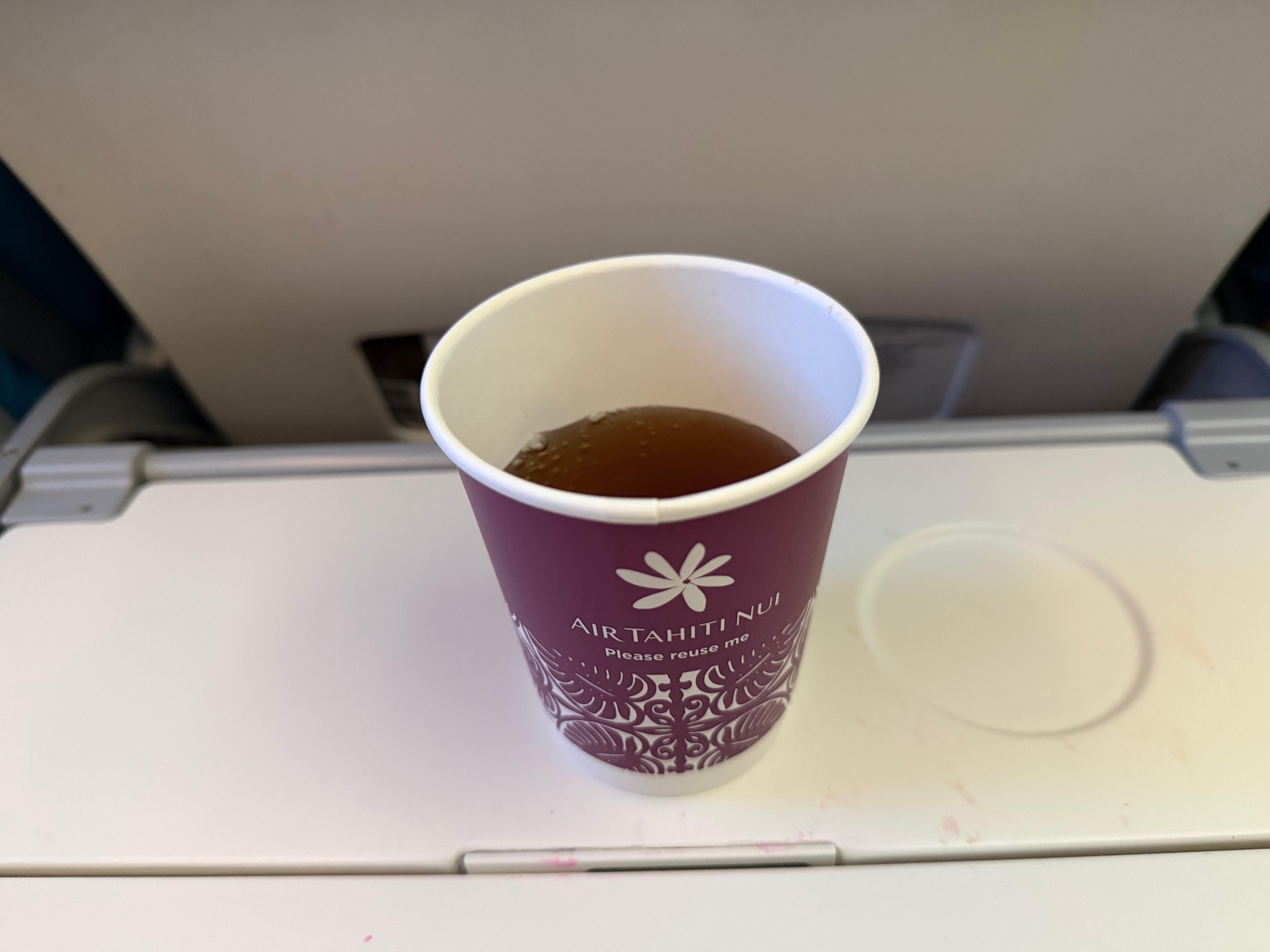 Hot drink served in an Air Tahiti Nui paper cup.