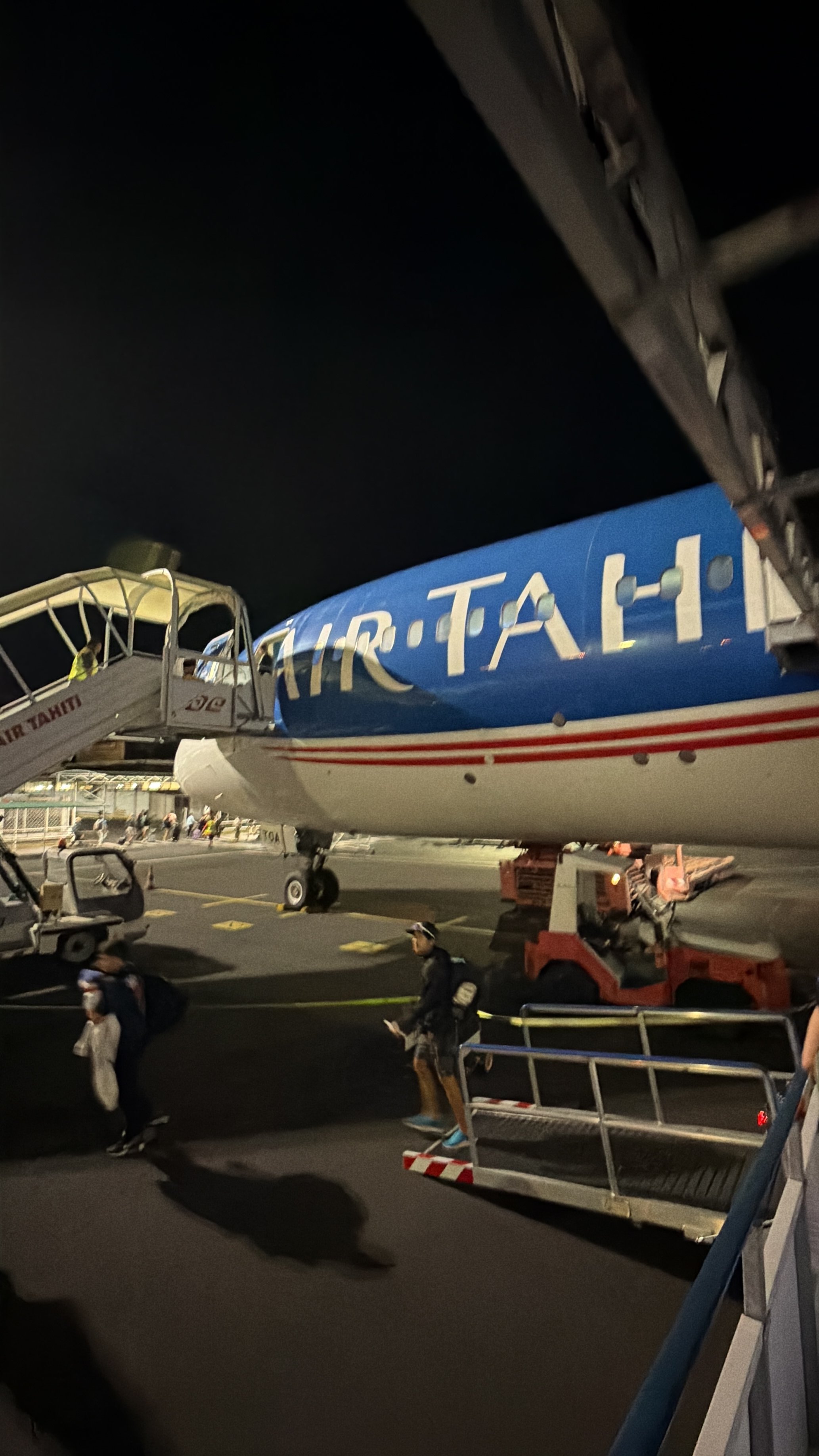 Air Tahiti Nui Boeing 787-9 after arrival at Papeete Airport at night.