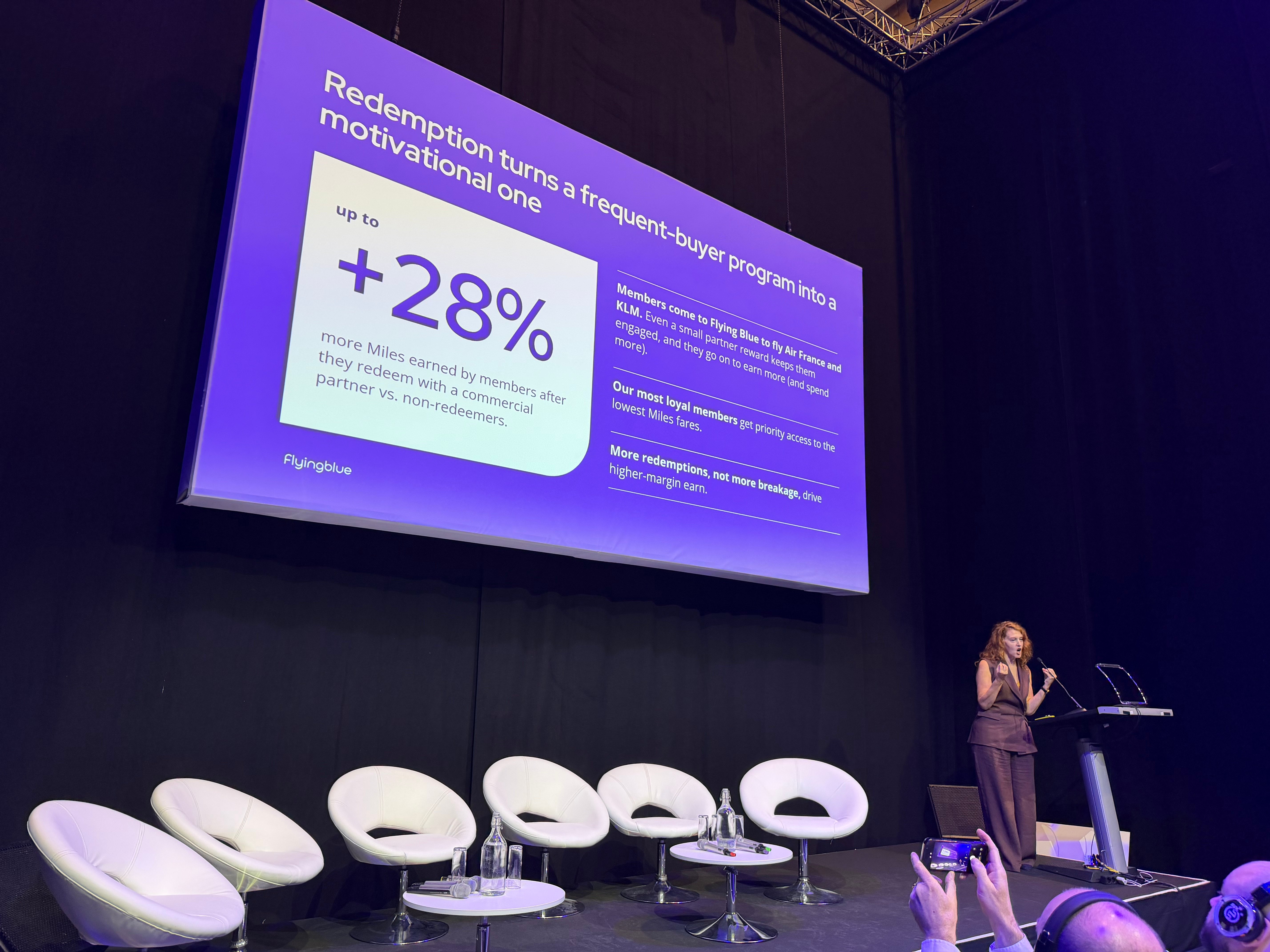 Tiffany Funk presenting a Flying Blue slide titled Redemption turns a frequent-buyer program into a motivational one.
