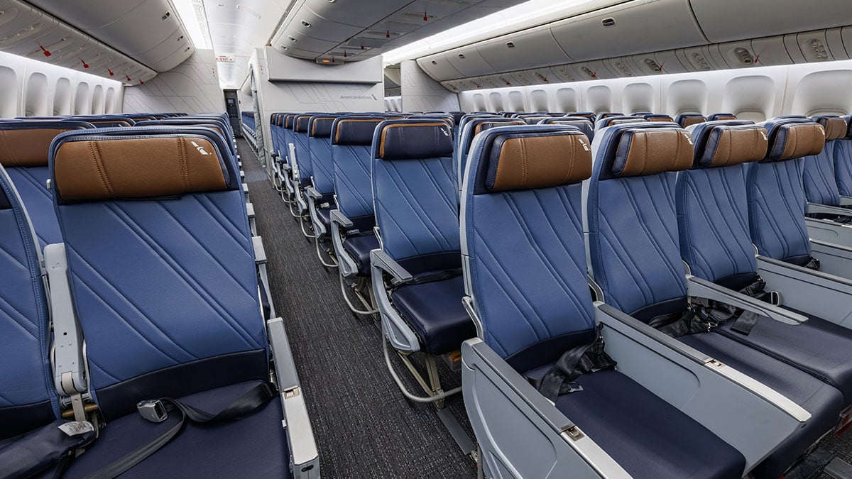 Blue Main Cabin seats with brown headrests on the refurbished American Airlines Boeing 777.