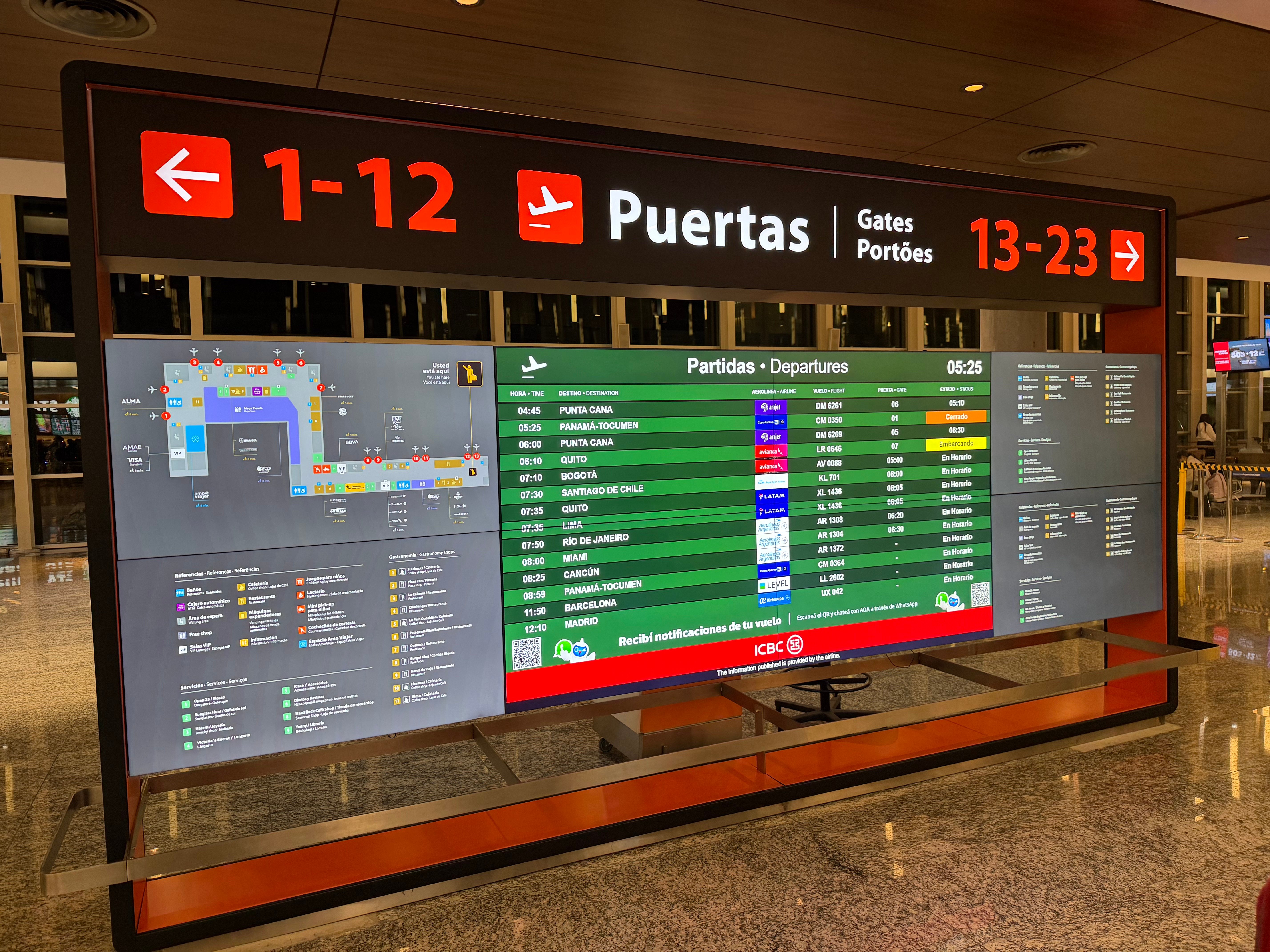 Departure gate information signs inside Buenos Aires Ezeiza airport.