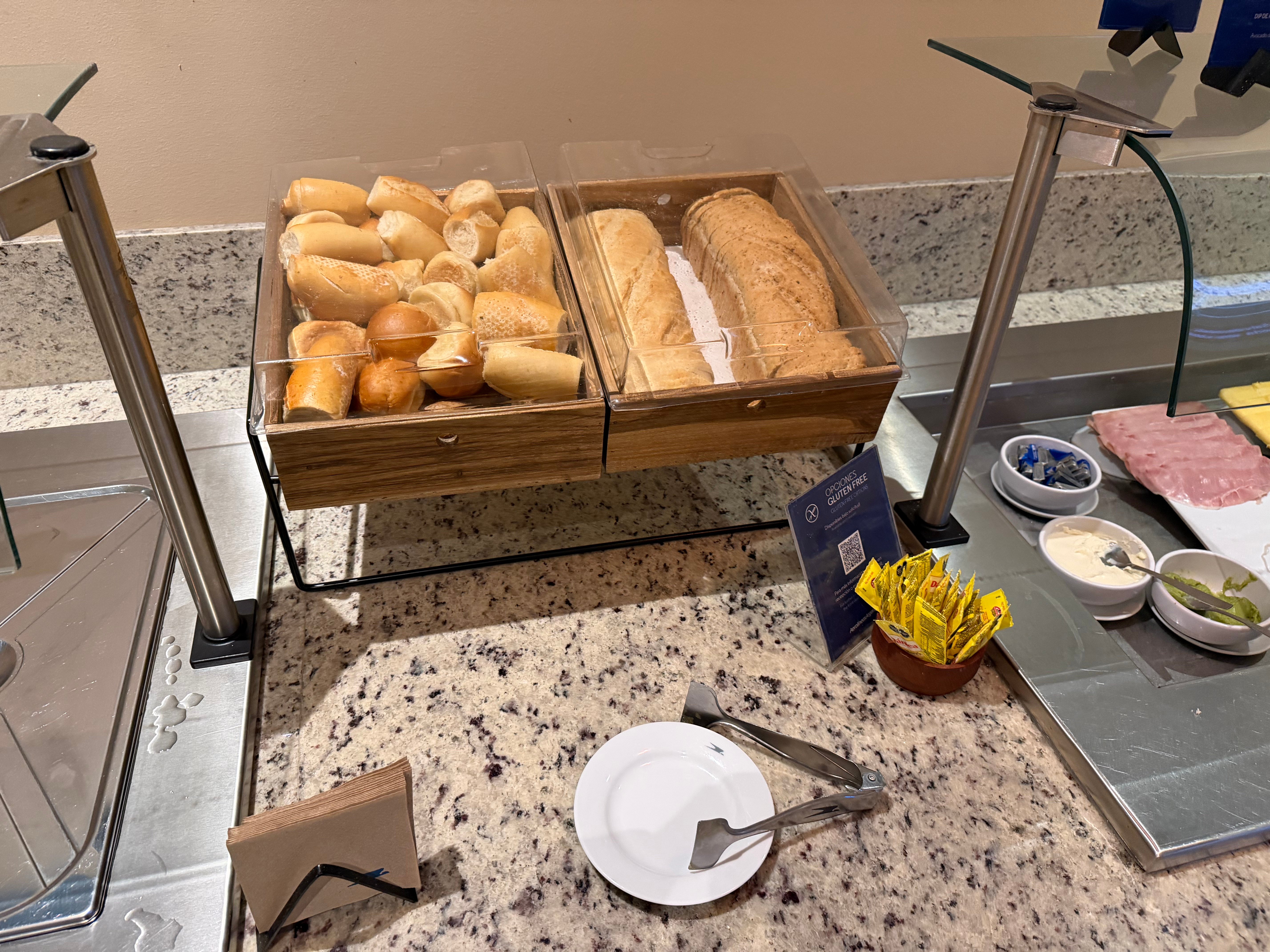 Bread selection at the Aerolíneas Argentinas Condor Lounge breakfast buffet.