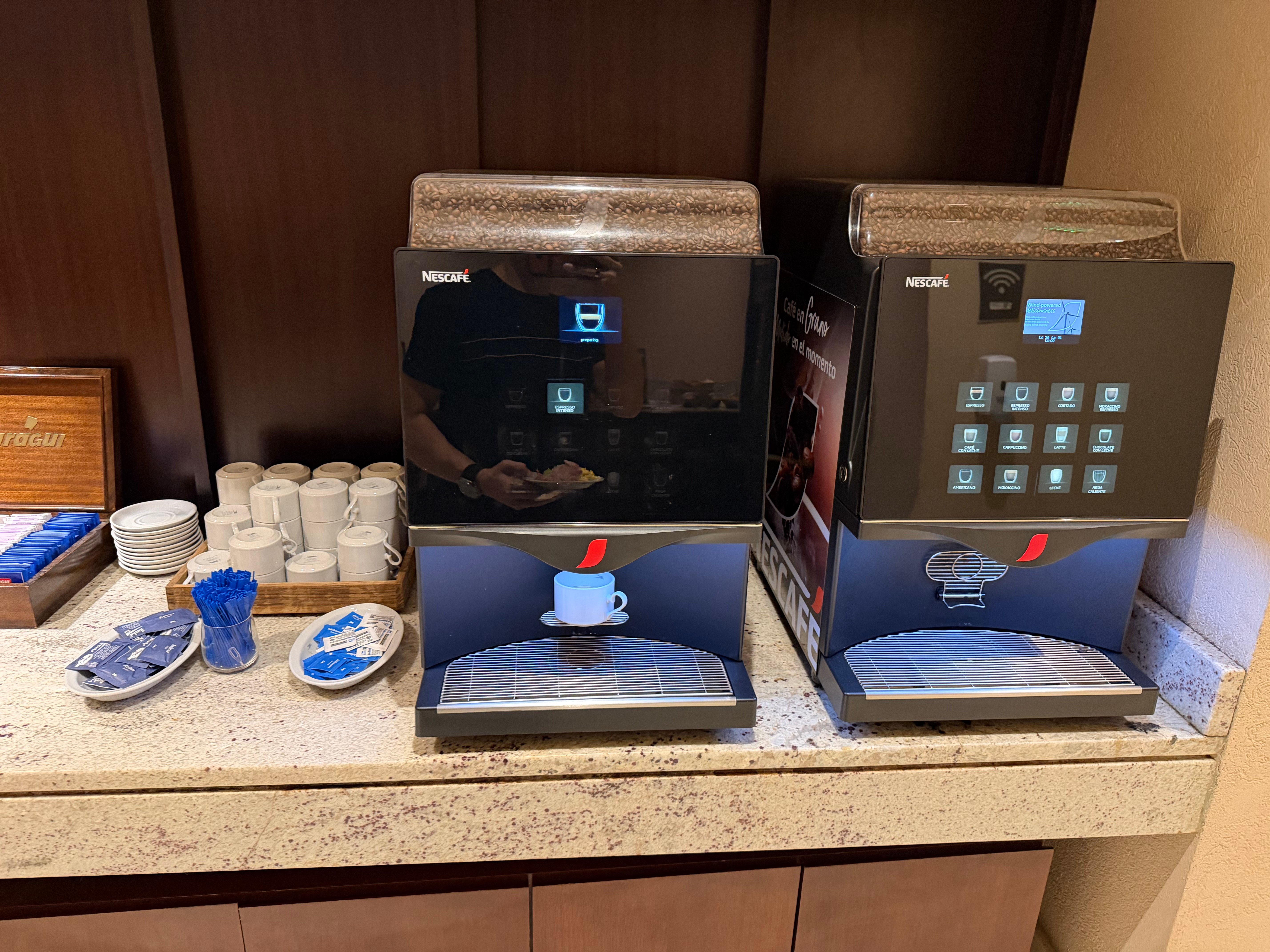 Coffee machines inside the Aerolíneas Argentinas Condor Lounge.