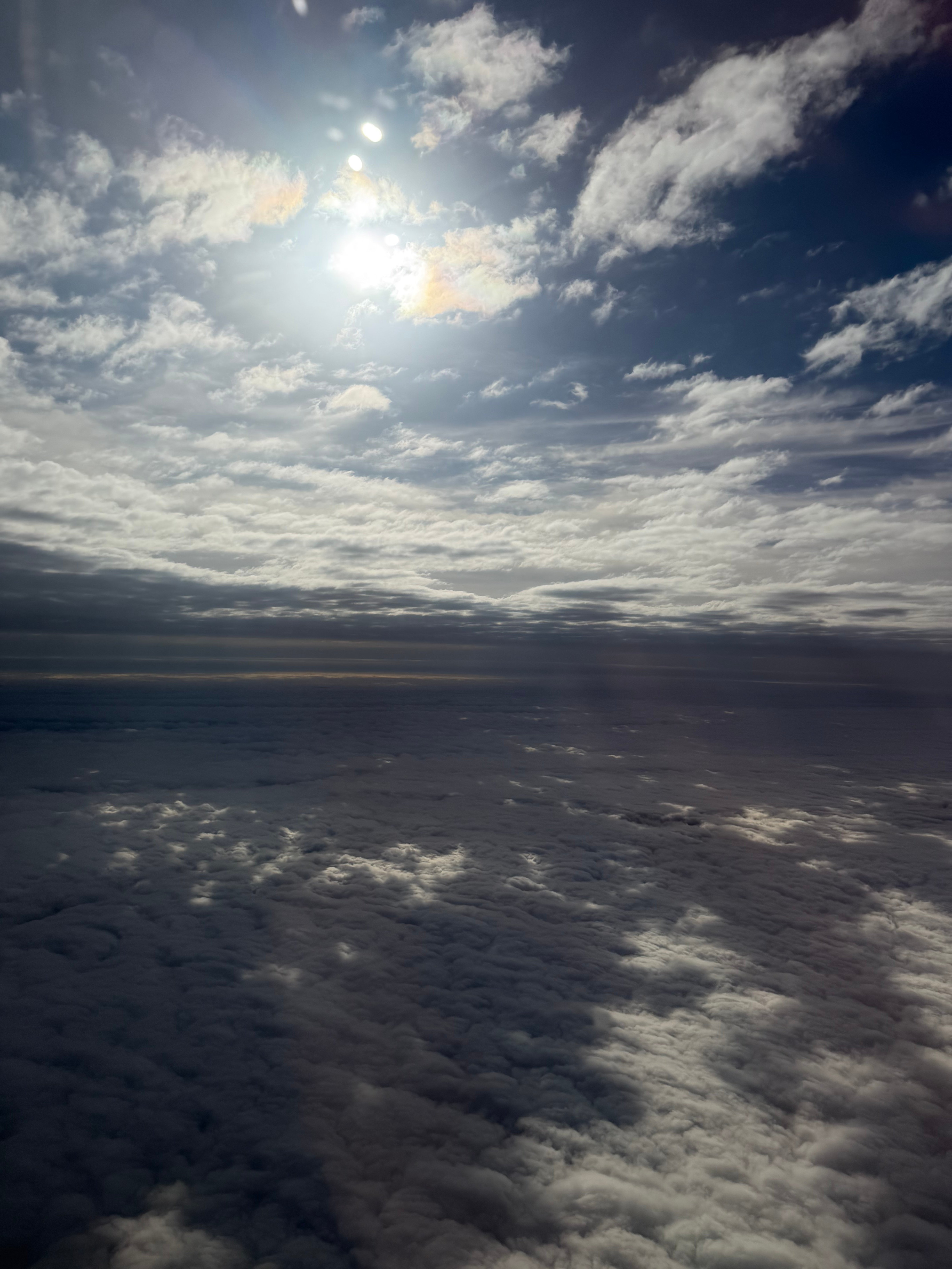 Sunlight above the clouds during the flight from Buenos Aires to Miami.