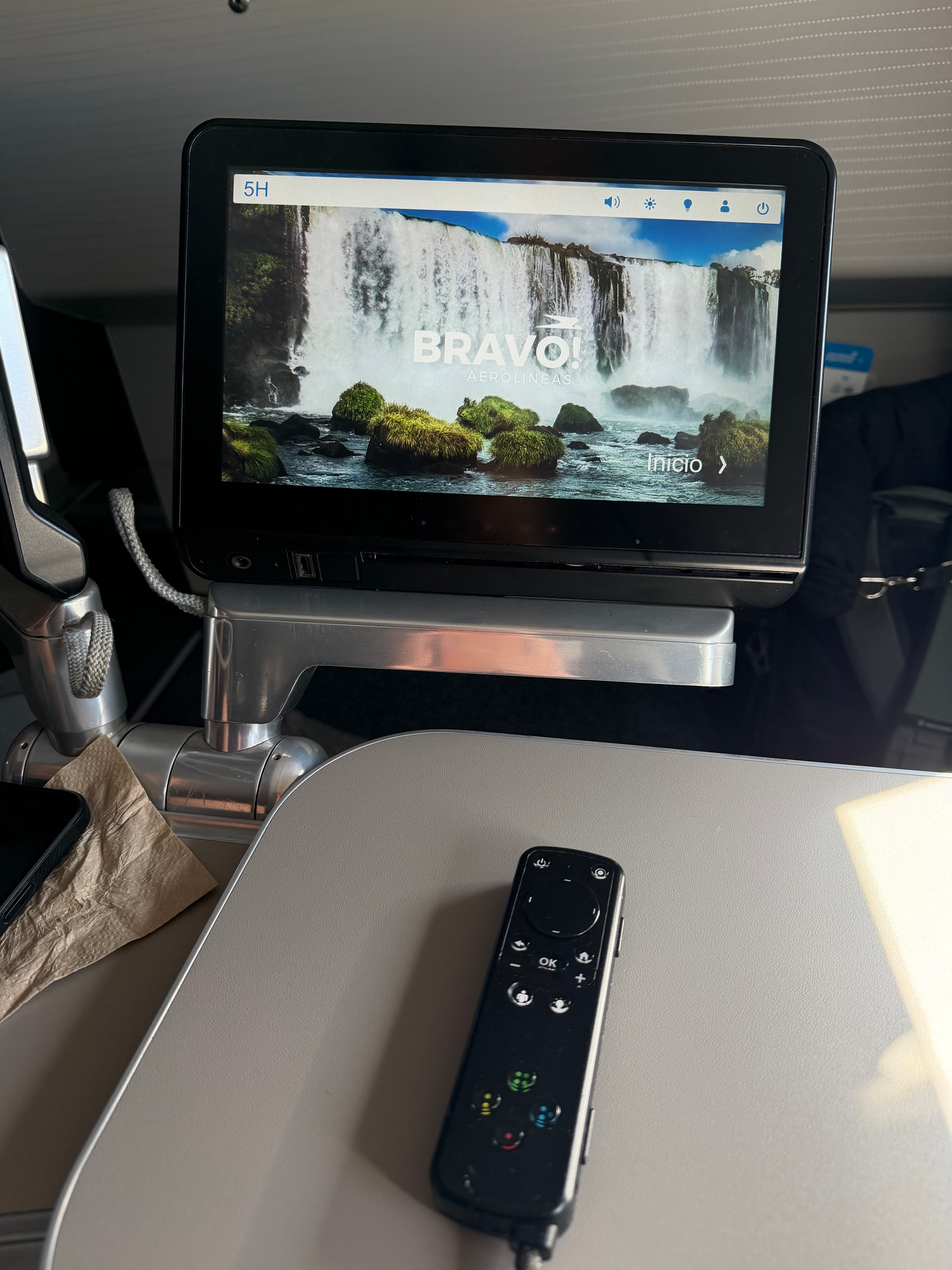 Inflight entertainment screen and remote in Aerolíneas Argentinas A330 Business Class.