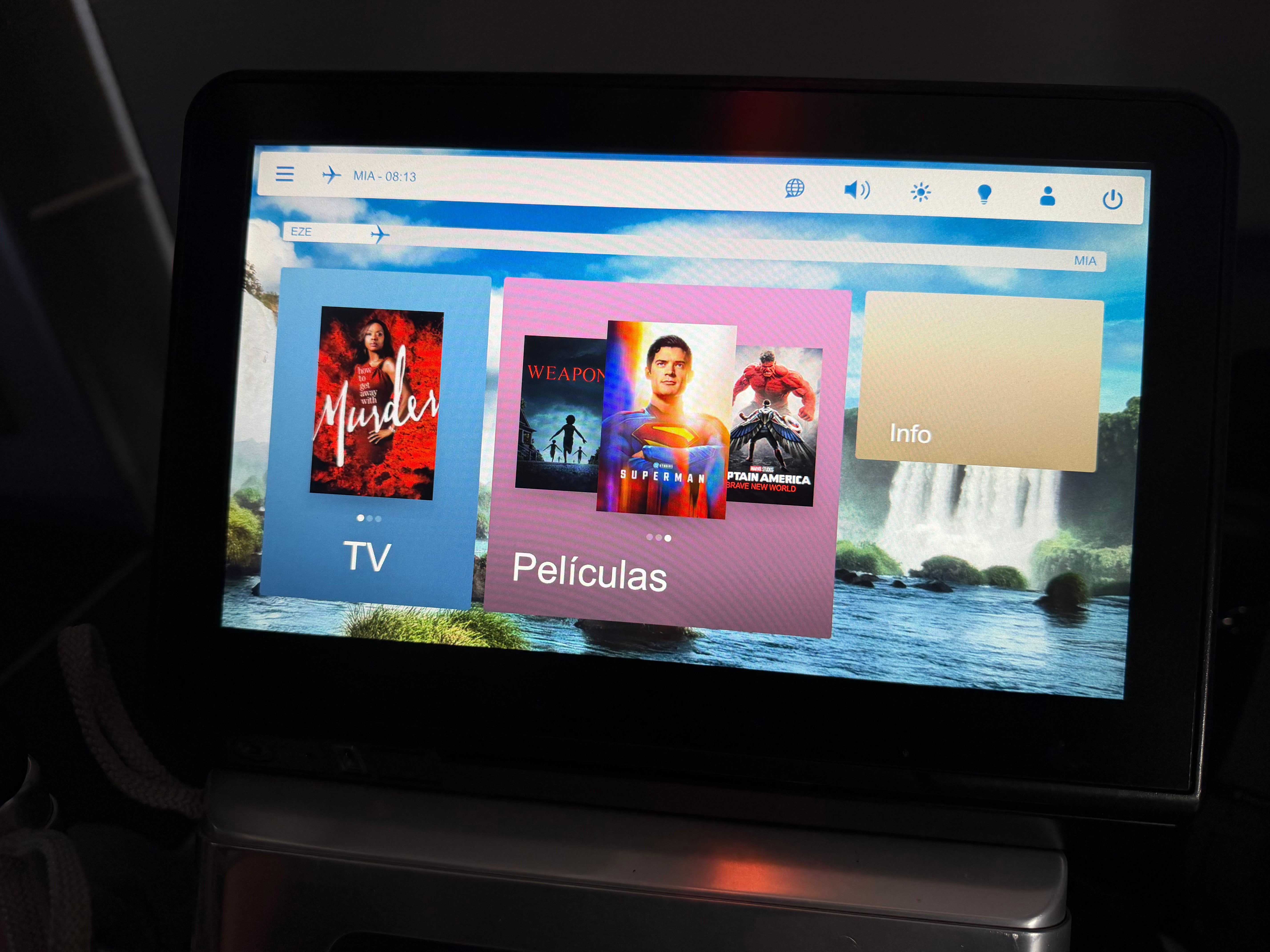 Inflight entertainment screens at adjacent Aerolíneas Argentinas Business Class seats.