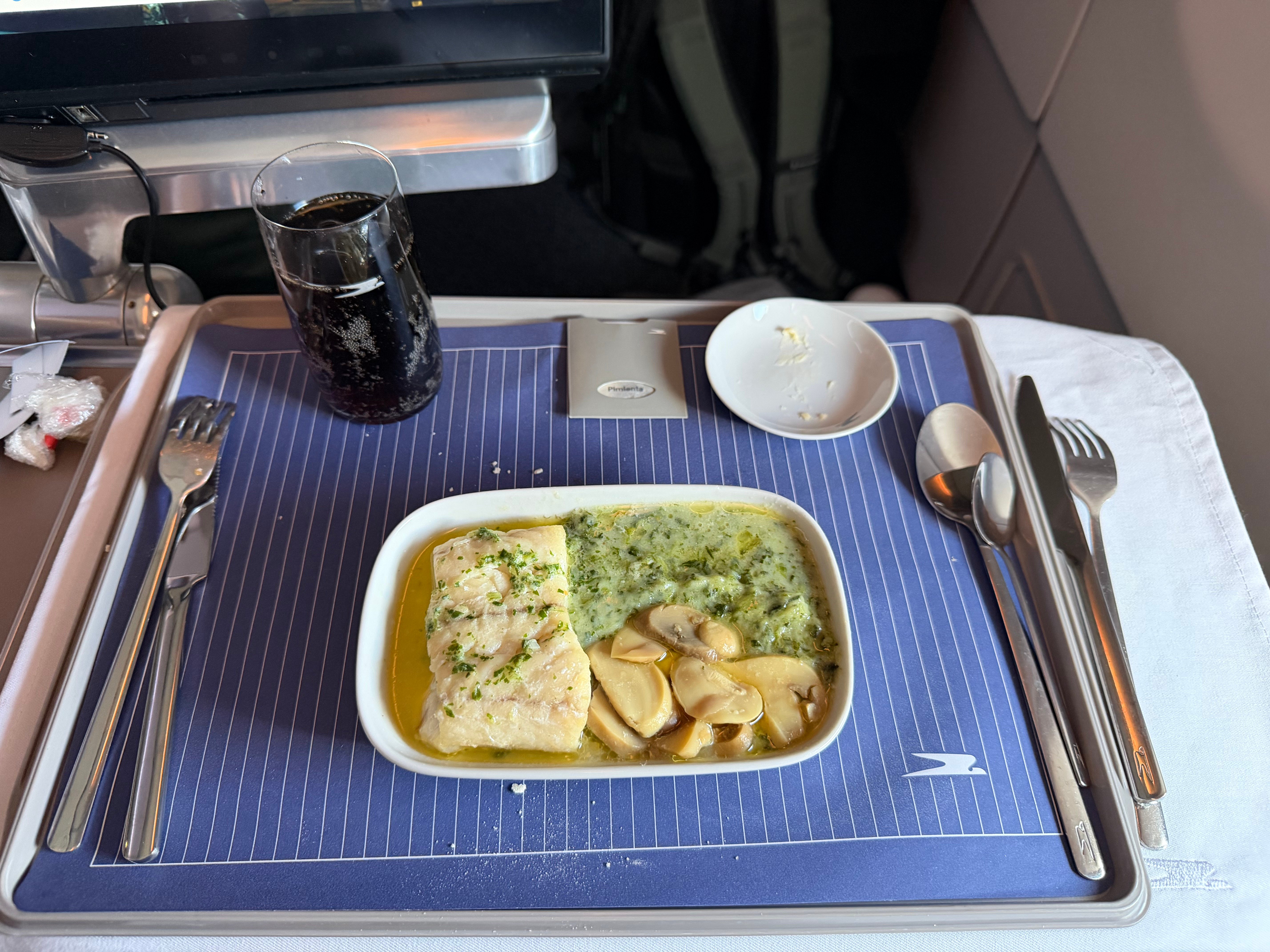 White fish main course served for lunch in Aerolíneas Argentinas Business Class.