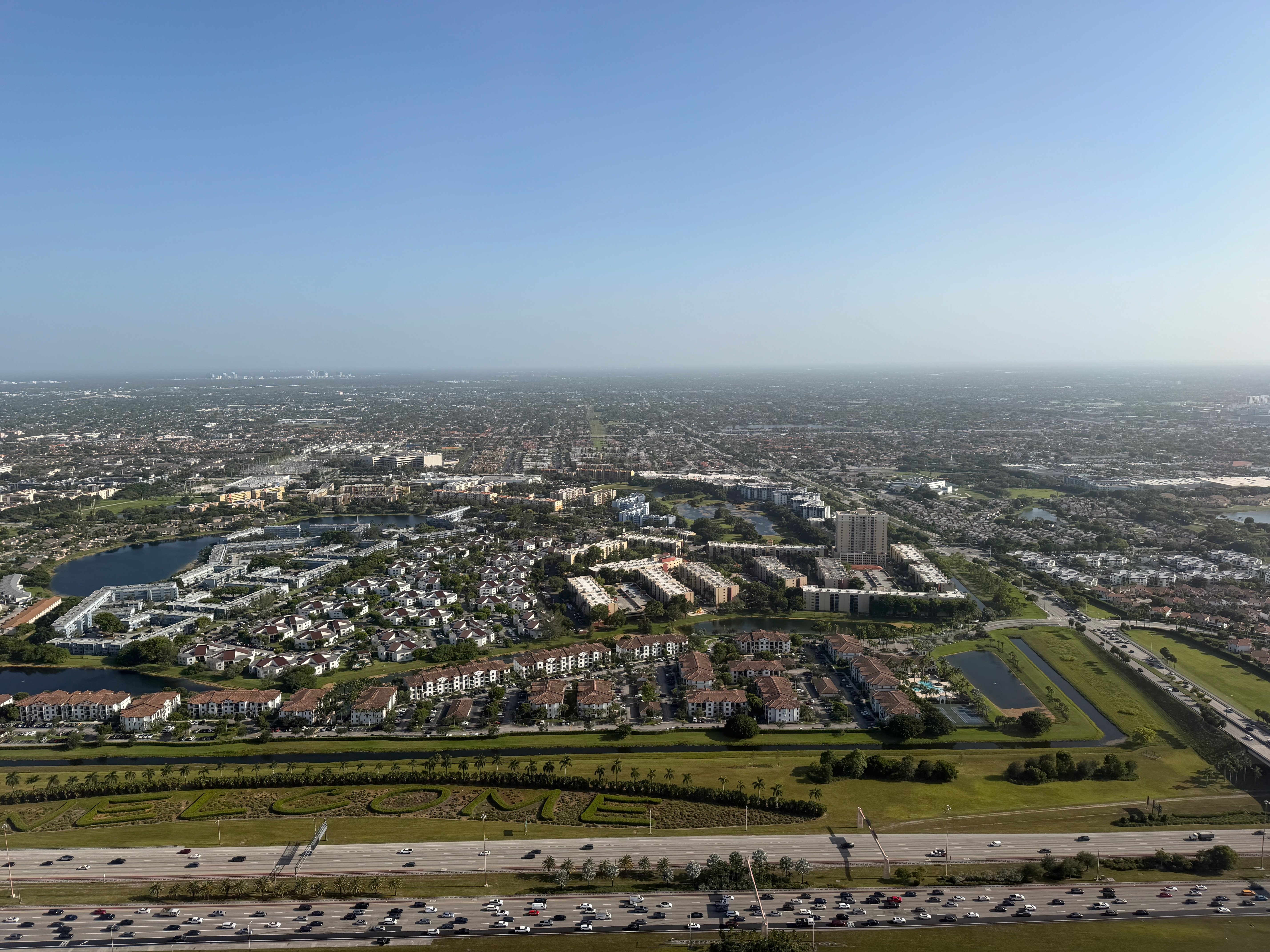 Miami neighborhoods and highways seen from the air before landing.
