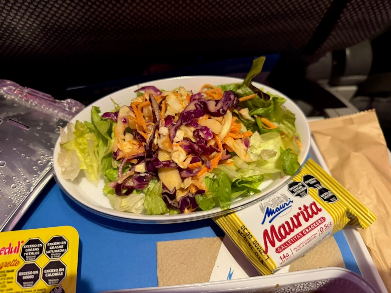 Close-up of the side salad served with dinner in Aerolíneas Argentinas economy.