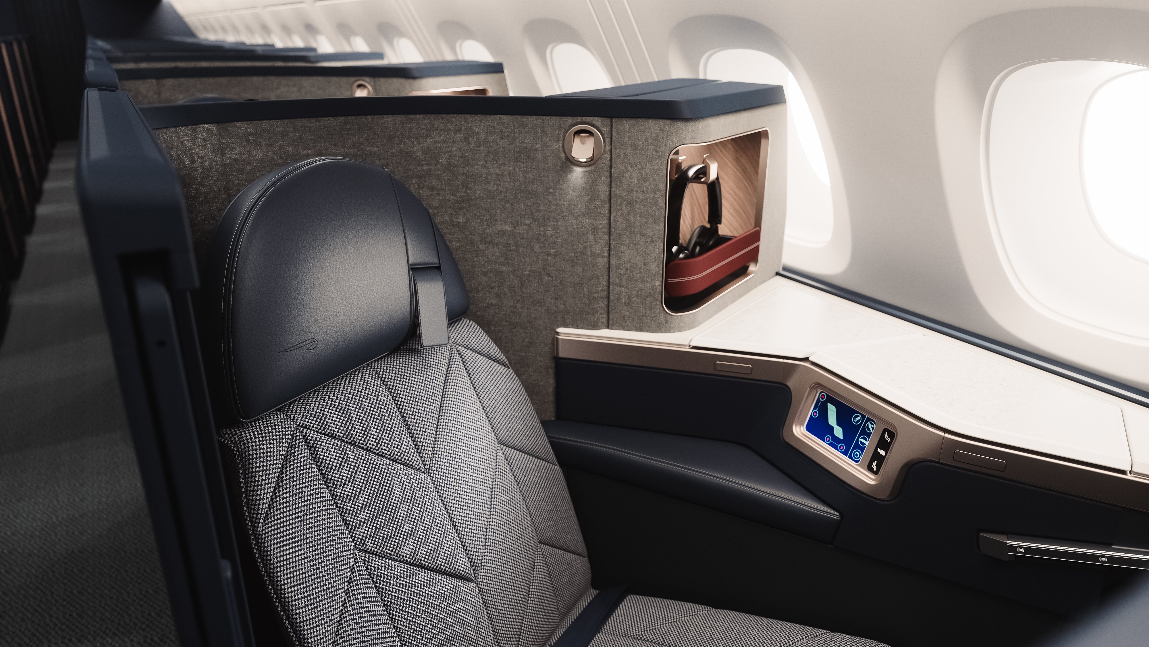 Close-up rendering of the updated Club Suite, showing the seat, side storage and window-side console.