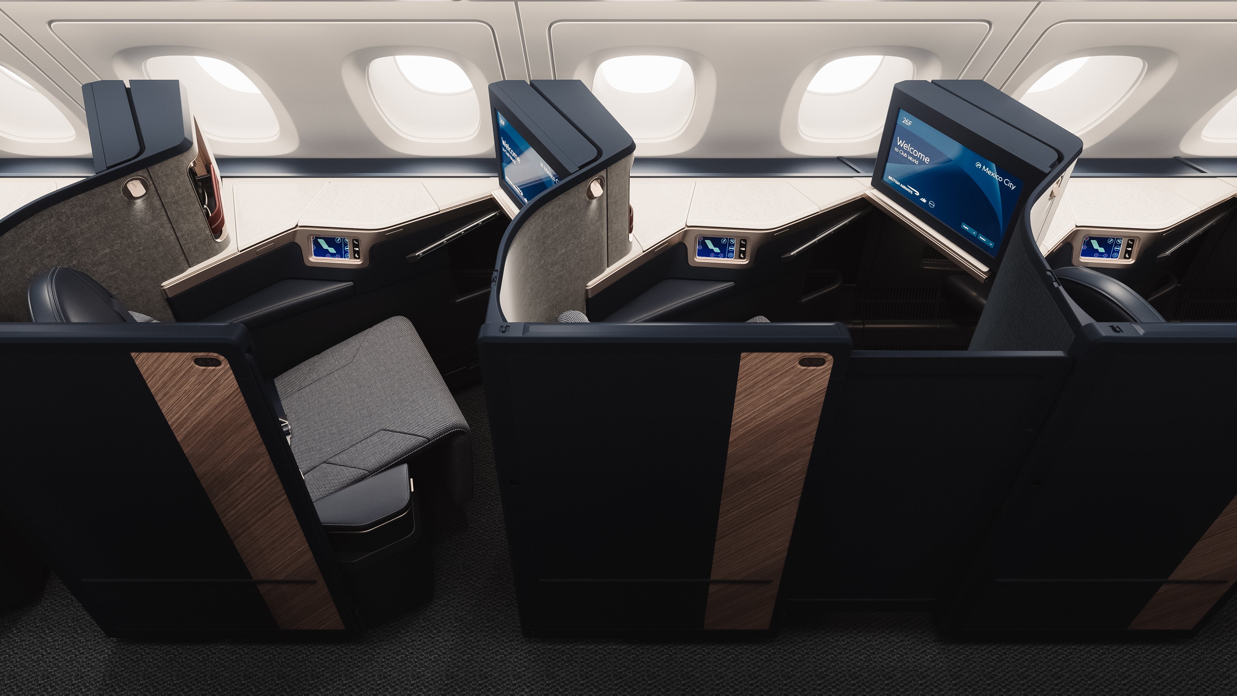 Window-side Club Suites with privacy partitions and individual entertainment screens.