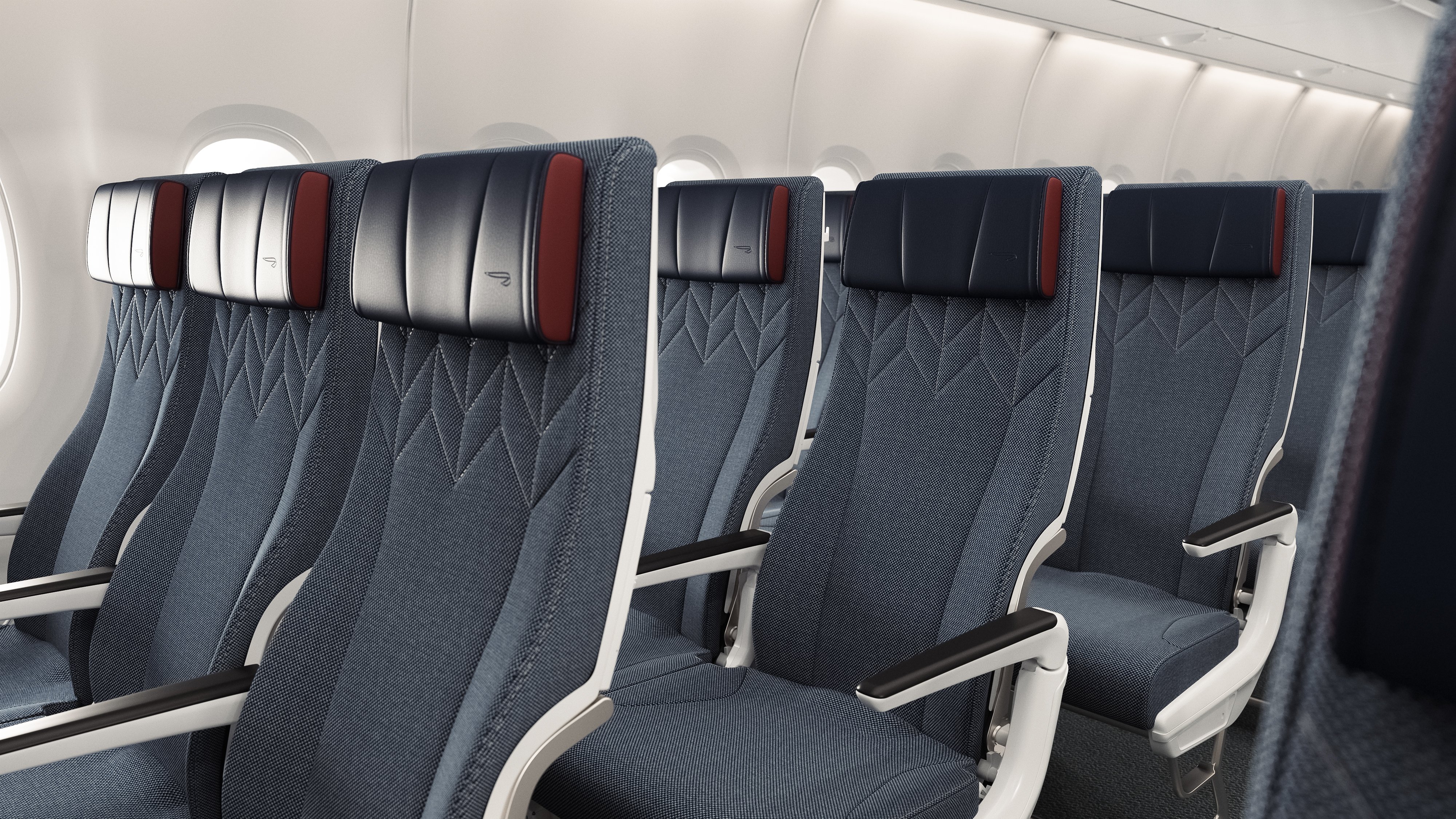 Close view of the new World Traveller seats and adjustable headrests.