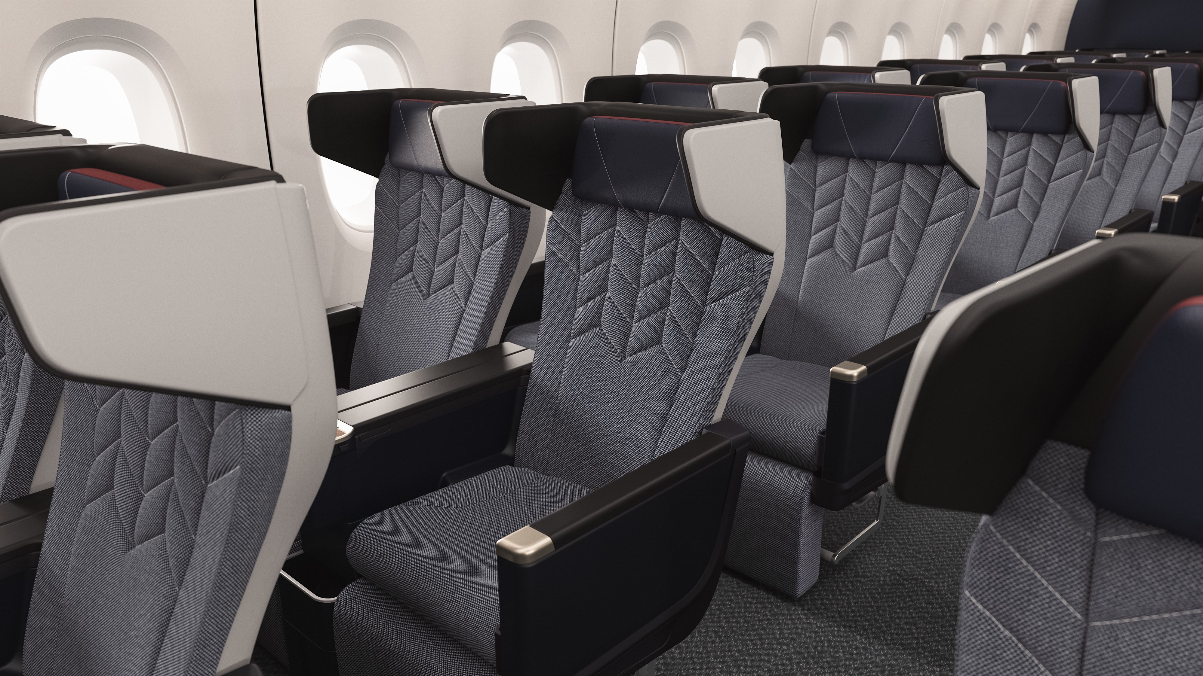 World Traveller Plus seats with large privacy wings around the headrests.
