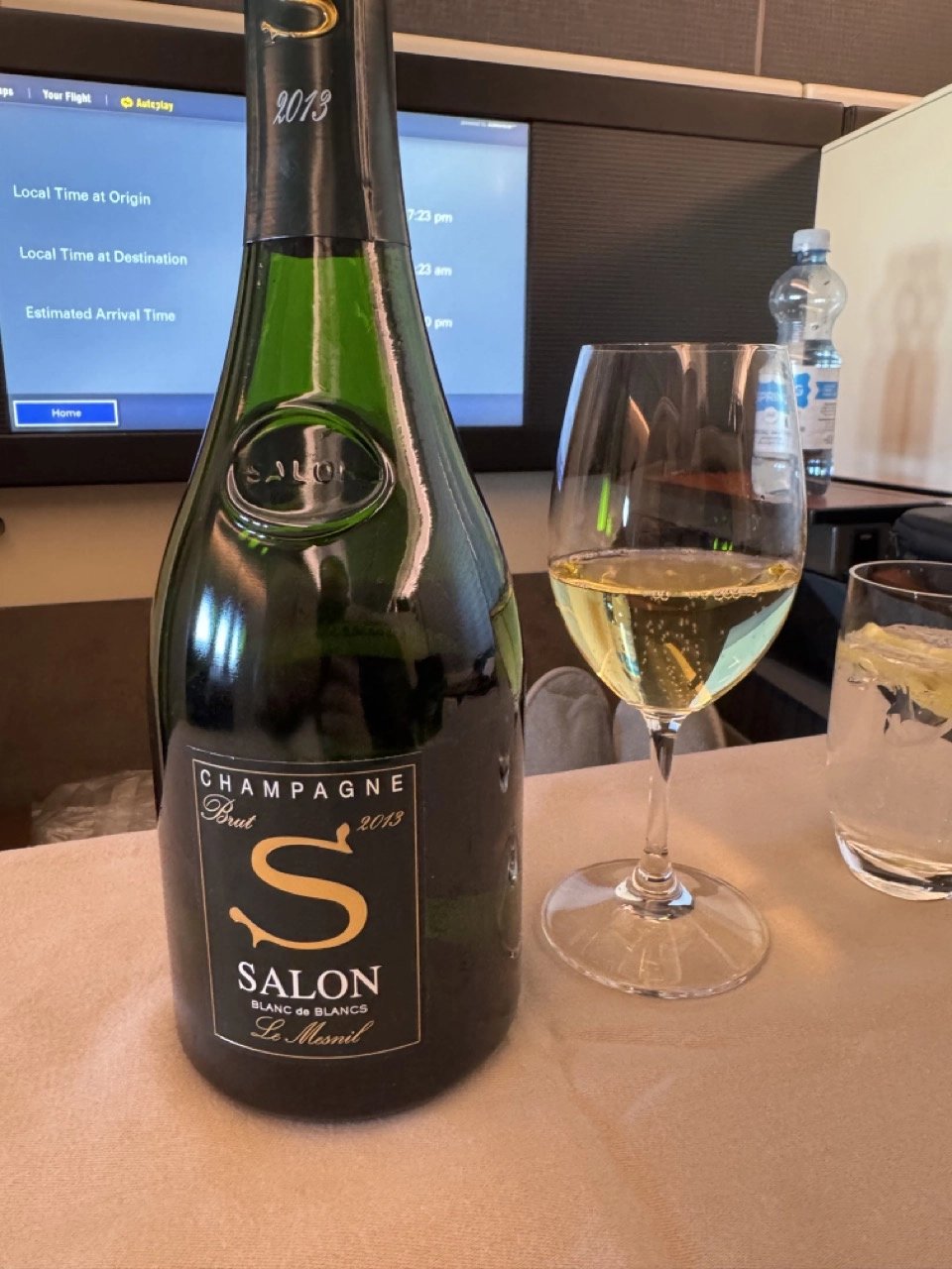 A glass of Salon 2013 Champagne being poured in JAL First Class