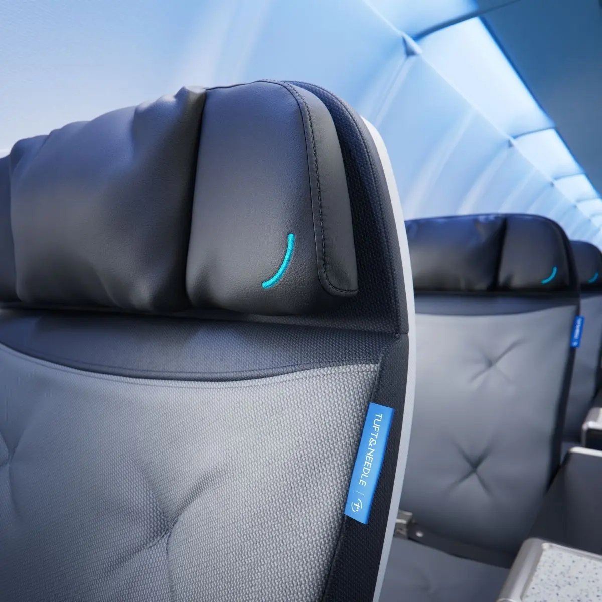 Close view of the Tuft and Needle headrest and fabric on a JetBlue BlueFirst seat.