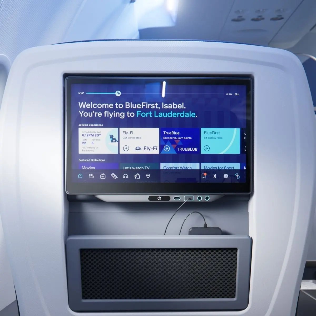 JetBlue BlueFirst 13.3 inch seatback screen with USB ports and a power outlet below it.
