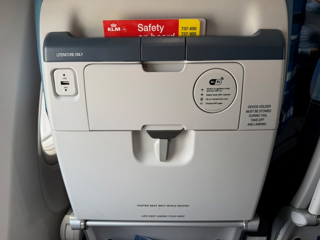 KLM ARN AMS seatback table closed on the KLM Amsterdam to Buenos Aires review.