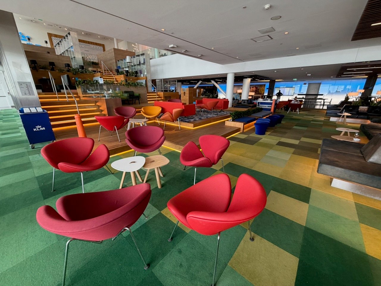 Amsterdam KLM crown lounge red chair area on the KLM Amsterdam to Buenos Aires review.