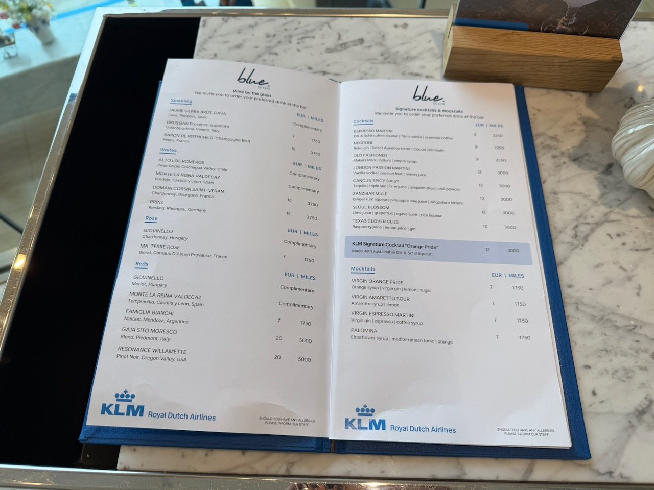 Amsterdam KLM crown lounge blue bar menu on the KLM Amsterdam to Buenos Aires review.