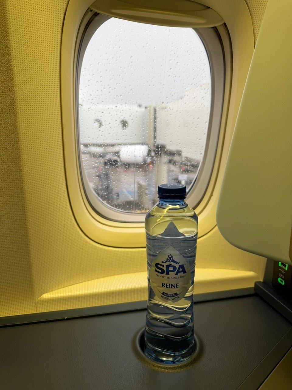 KLM AMS EZE bottled water at window on the KLM Amsterdam to Buenos Aires review.