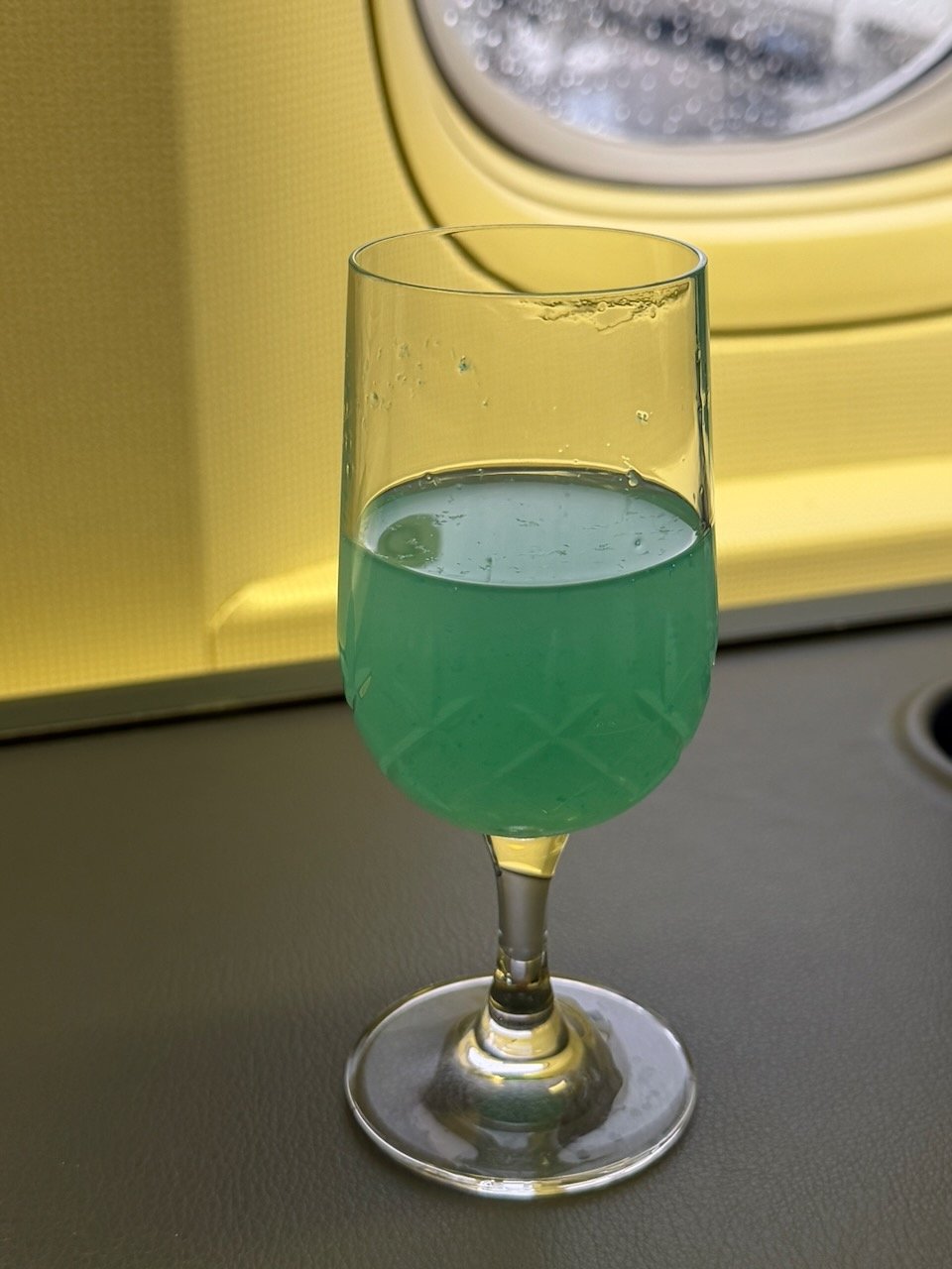 KLM AMS EZE blue welcome drink on the KLM Amsterdam to Buenos Aires review.