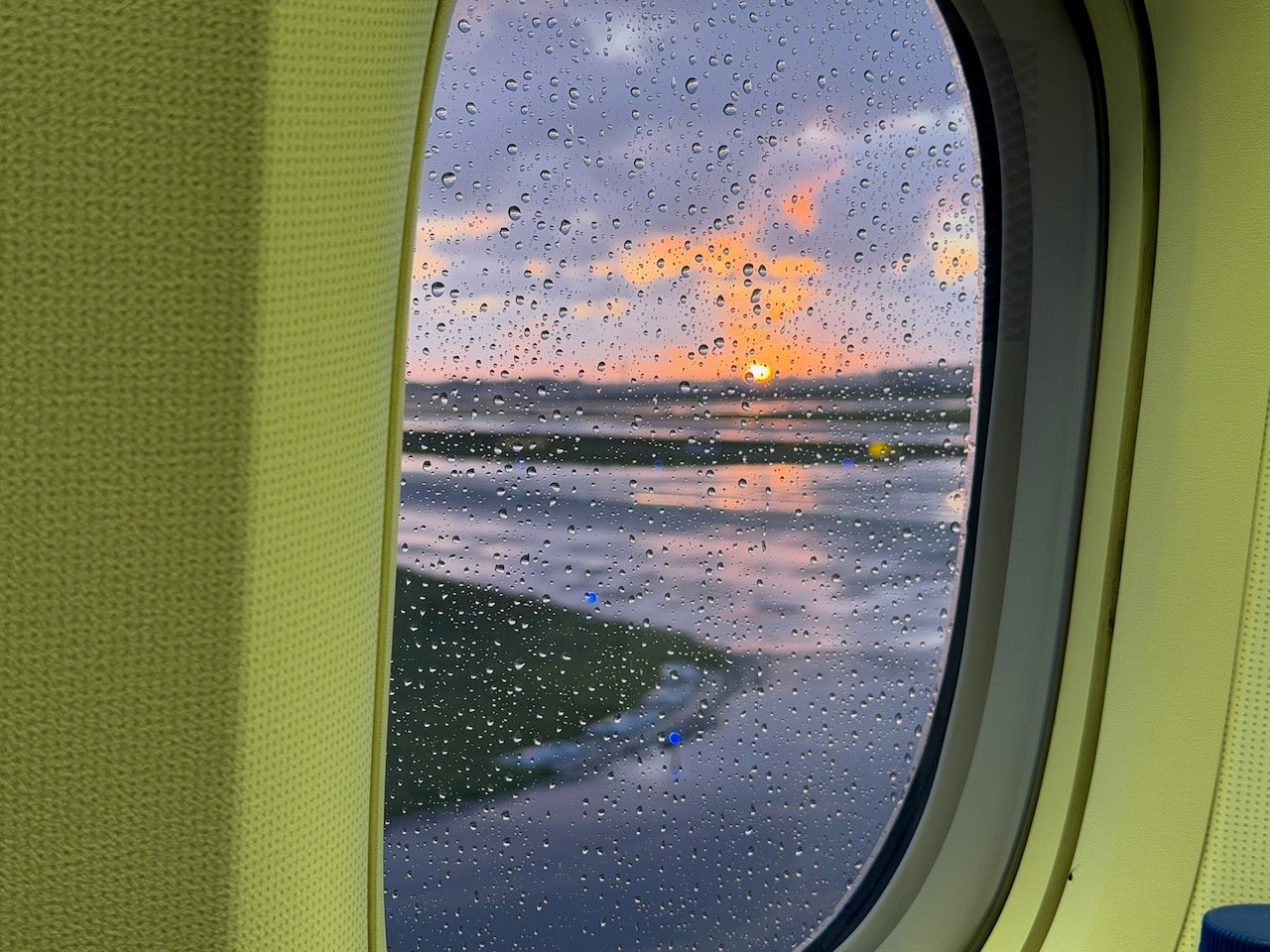 Amsterdam Schiphol rainy window view on the KLM Amsterdam to Buenos Aires review.