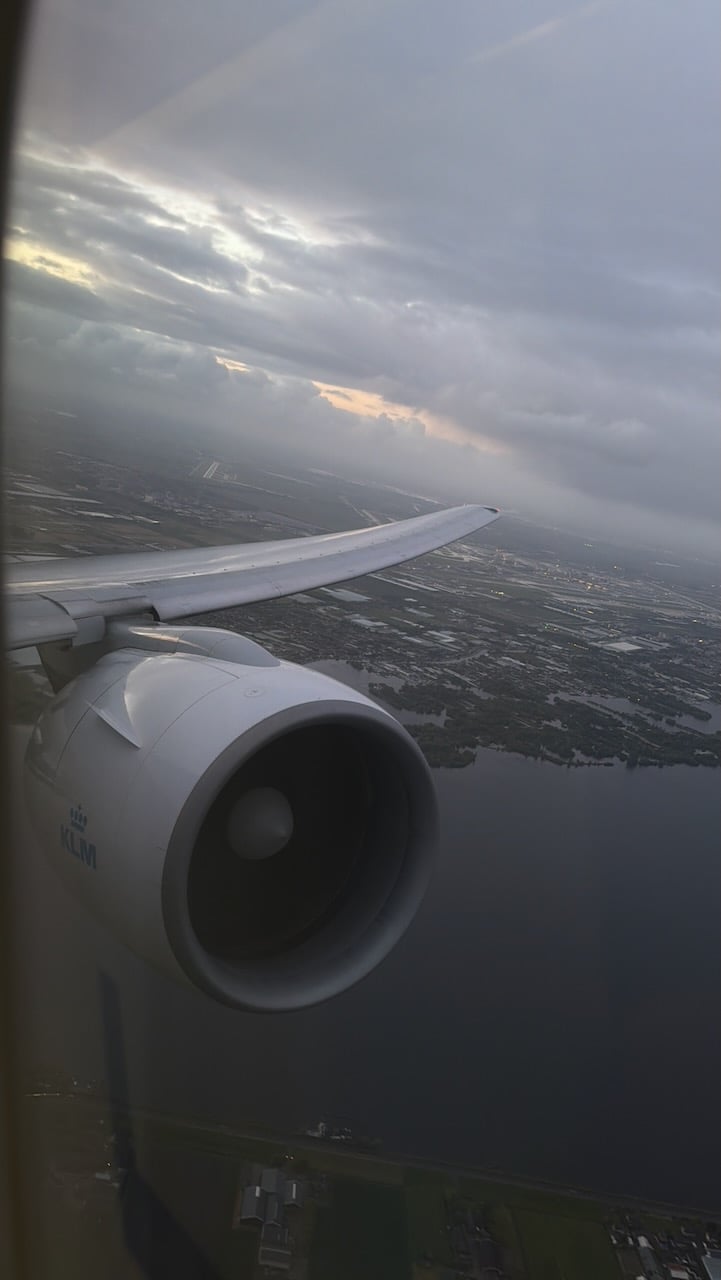 KLM AMS EZE cloudy climb wing view on the KLM Amsterdam to Buenos Aires review.