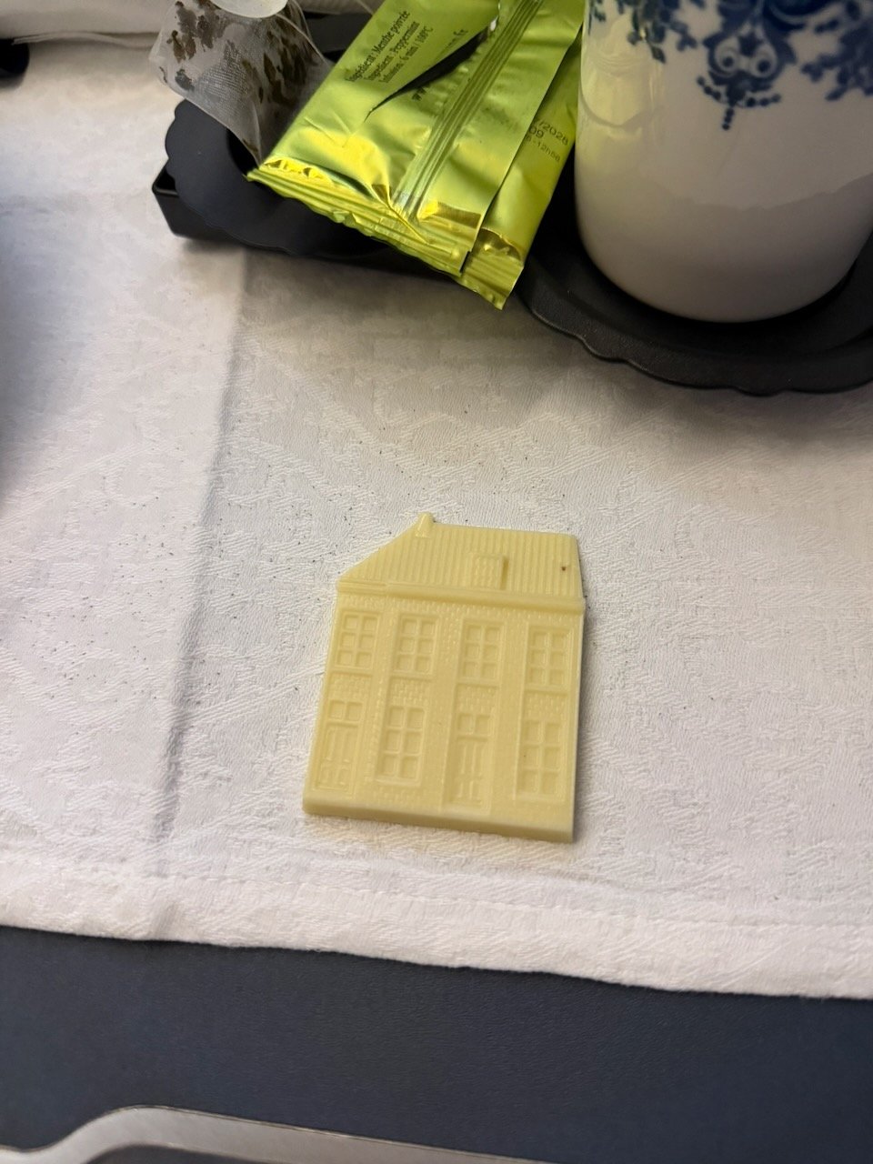 KLM AMS EZE white chocolate Delft house on the KLM Amsterdam to Buenos Aires review.