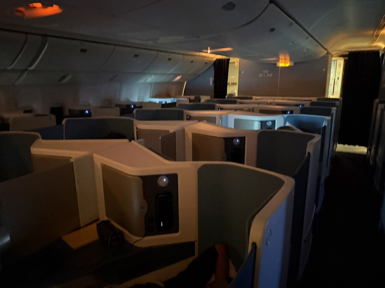 KLM AMS EZE dark business class cabin on the KLM Amsterdam to Buenos Aires review.