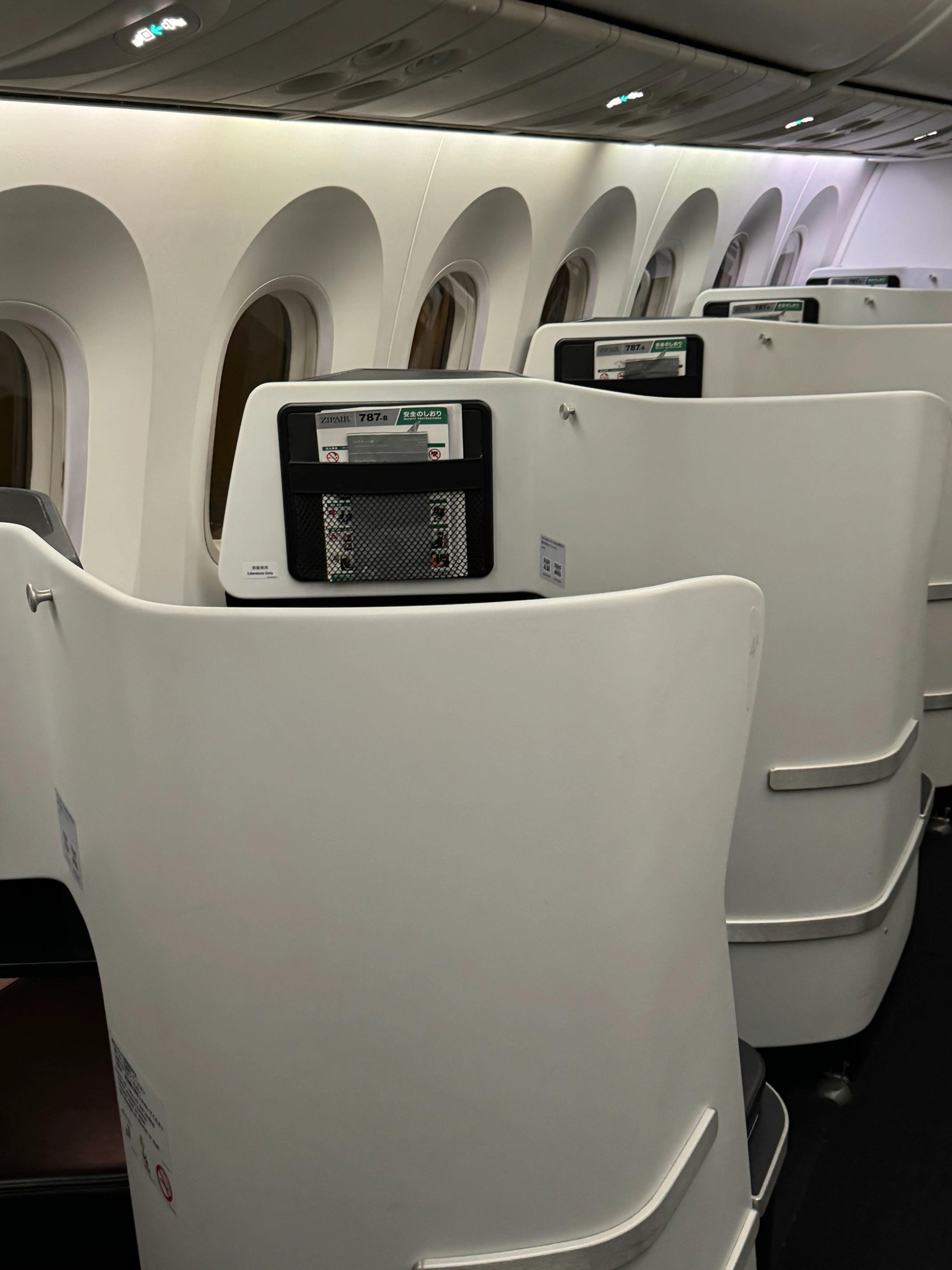 Looking down the aisle of the ZIPAIR 1-2-1 cabin.