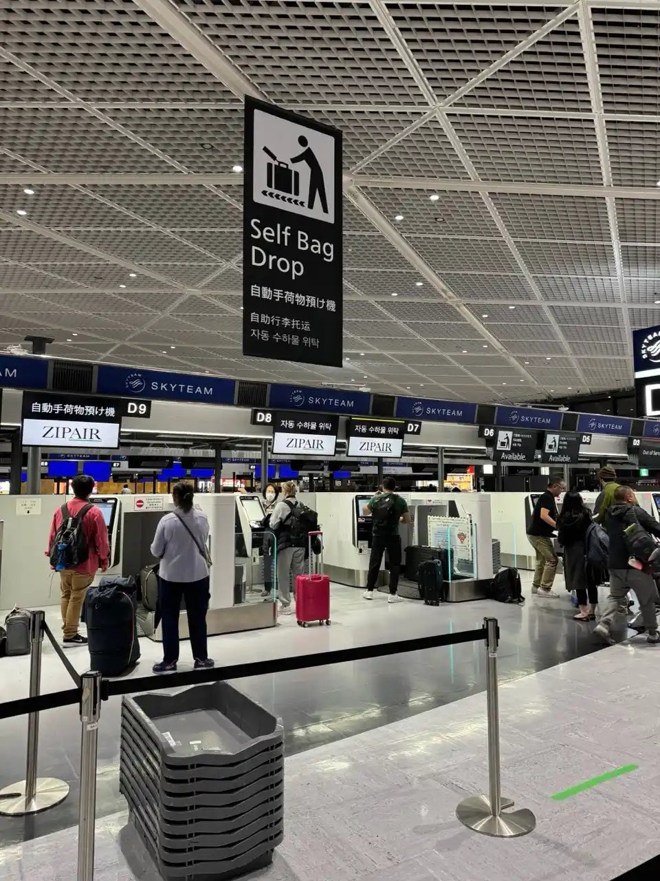Automated check-in kiosks for ZIPAIR at Narita Airport.